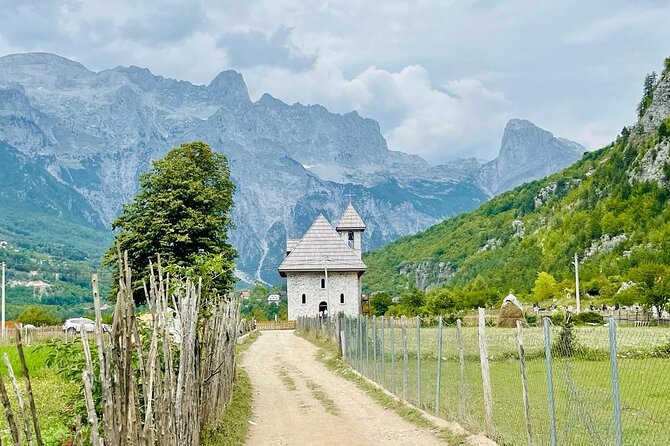 Full Day Tour to Albanian Alps Theth, Grunas Waterfall, Blue Eye - Theth village, church, and blood-feud tower