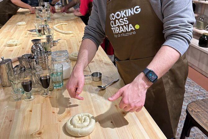 Traditional Albanian Cooking Class in Tirana with Raki Tasting - Rolling dough for cottage-cheese burek
