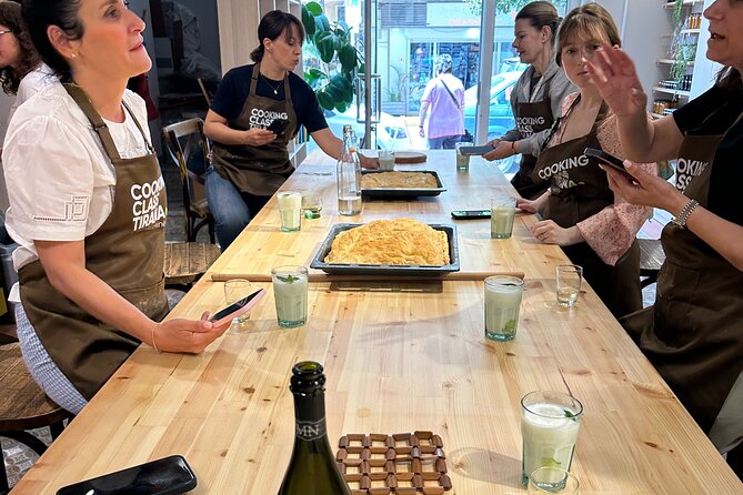 Traditional Albanian Cooking Class in Tirana with Raki Tasting - Preparing village chicken with pershesh